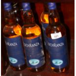 Five bottles of Aran Loch Ranza whiskey and a bottle of Bushmills "Black Bush" Irish whiskey