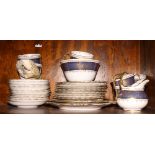 A Chelsea blue and gilt decorated part teaset