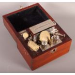 A reproduction brass level and an electrical scalp treatment machine, in wooden case