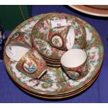 A set of three 20th Century famille verte decorated soup bowls, five similar saucer dishes and