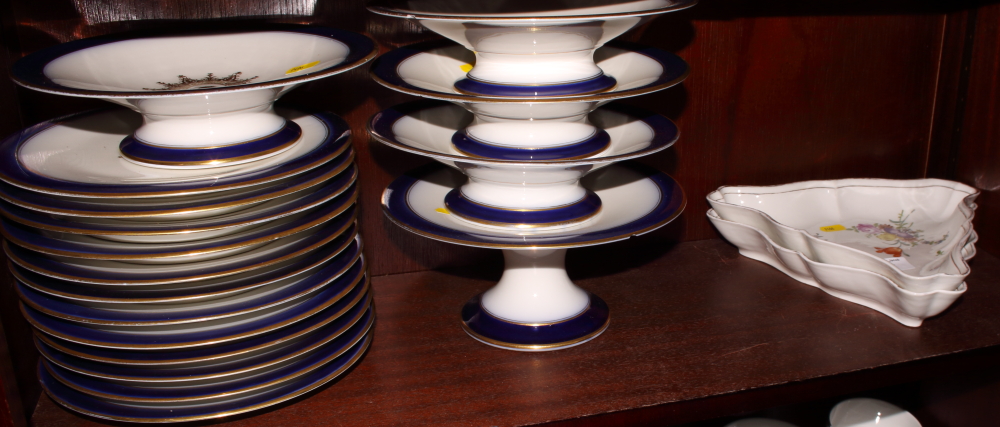 A Limoges dessert service with blue and gilt decoration and a pair of continental porcelain shaped