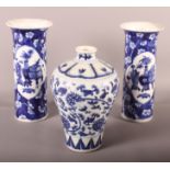 A pair of Chinese blue and white precious object decorated cylinder vases (flared rim is