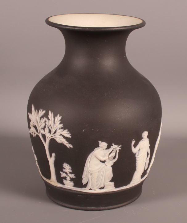 A 19th Century Wedgwood black basalt jasper dip vase decorated in the classical manner