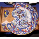 A Gubbio style faience dish, the centre painted Roman soldiers and horses, 15" dia (for