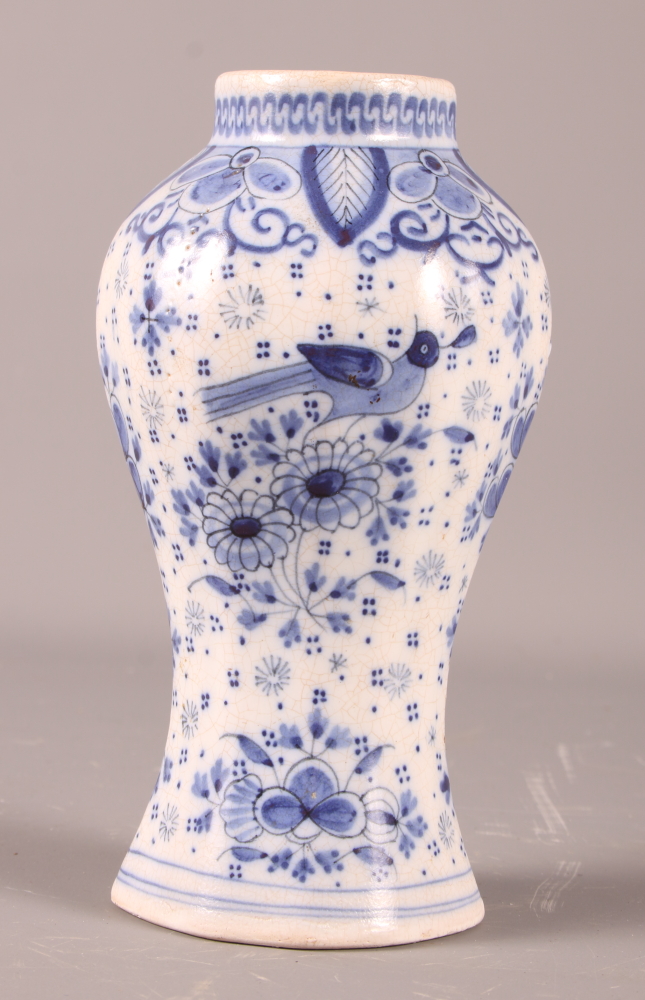 A Delft oviform jar with bird and scroll decoration, 6" high