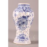 A Delft oviform jar with bird and scroll decoration, 6" high