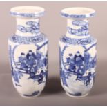 A pair of Chinese blue and white figure decorated vases, 9" high