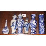 Three Chinese blue and white oviform jars and covers, a cylindrical vase, a sprinkler bottle, and