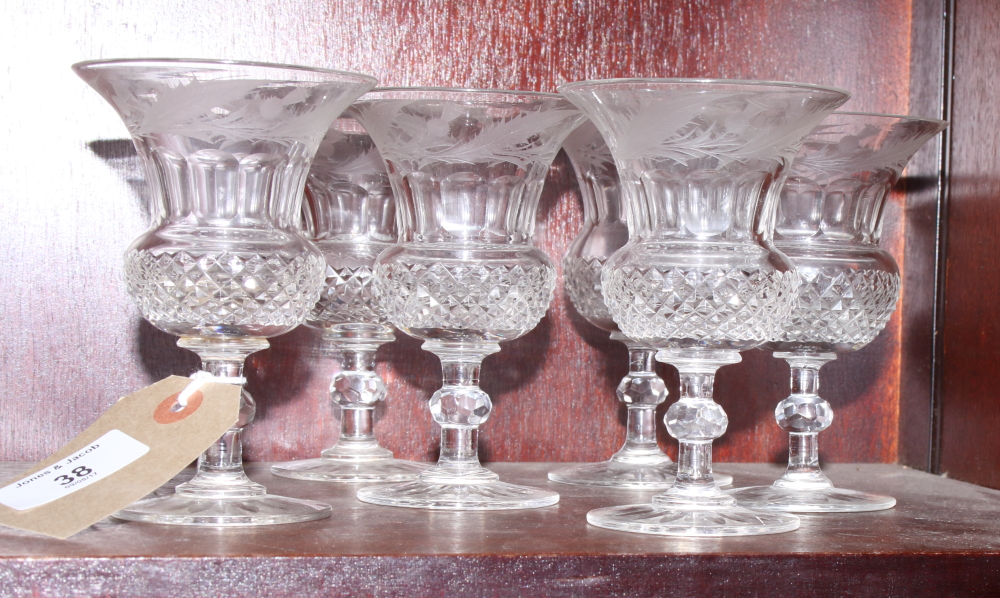 A set of six wine glasses with thistle shaped bowls, engraved thistles and diamond cutting (very