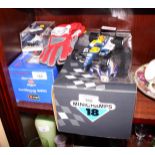 A Minichamps boxed die-cast model of Damon Hill's Formula 1 racing car, three other racing cars