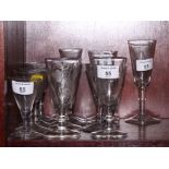 Five 19th Century glasses with conical bowls, engraved barley and hops, and eight similar plain ales