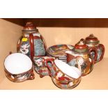 A Japanese eggshell porcelain teaset, painted Immortals