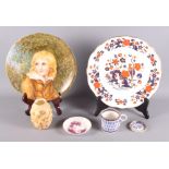 A late 19th Century porcelain plate decorated with figure of a boy, 9" dia, an Aynsley Imari