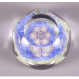 A window cut glass millefiori paperweight