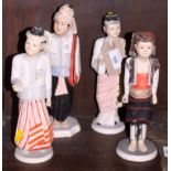 A set of four Burmese/Myanmar painted hardwood figures in traditional costume, 10" high