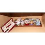 A collection of eighteen assorted decorative ceramic trinket boxes and a Crown Derby butter knife,