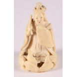 A late 19th Century Japanese carved ivory netsuke, formed as a geisha and oni, signed to the base,