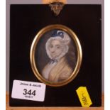 A late 18th Century portrait miniature on ivory of a woman in poke bonnet with shawl, inscribed