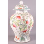 A modern Chinese peach and plant decorated oviform jar and cover, 16" high