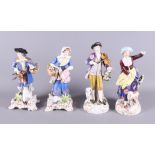 A pair of Continental porcelain figures, shepherdess and musician, 9" high, and a similar pair, on