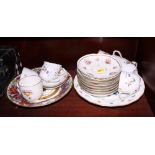 A set of 19th Century Meissen porcelain tea cups and saucers, painted flowers, a pair of modern