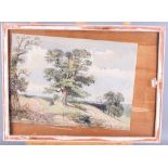 A late 19th Century watercolour, landscape with figure resting beneath a tree, 10" x 14"