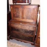 A 19th century Continental mahogany two-stage desk with fall front, the base fitted three drawers,