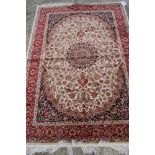A Keshan design silky pile rug on a beige ground, 75" x 55" approx