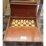 A 19th century turned ivory travelling chess set, in fitted case, 10 1/2" square