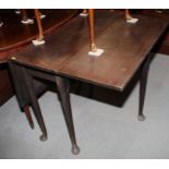 A mahogany drop leaf dining table, on pole turned supports, 36" wide