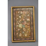 A Persian floral painted papier-mache book cover, 11 1/2" x 7 1/4", in gilt frame