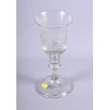 A 19th century glass goblet, bell-shaped bowl wheel engraved stag hunting scene, knopped stem with