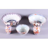 Three Imari decorated bowls, the largest 9" dia, and a pair of Imari decorated vases (cracks and