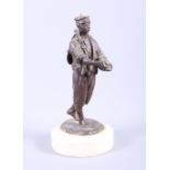 A bronze statue of a man with arms extended, on marble base, 9" high