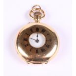 An 18ct gold cased lady's half hunter fob watch with white enamel dial