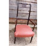 A 19th century mahogany high backed carver chair with reeded arms and red striped seat
