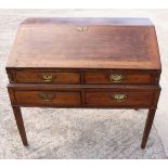 A provincial Georgian oak bureau, fitted four short drawers, on square supports, 42" wide