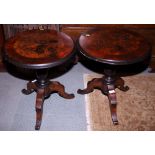 A pair of circular rosewood occasional tables, the tops inset floral marquetry panels, on tripod