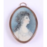 An early 19th century portrait miniature of an unknown woman in white dress with hair verso, in oval