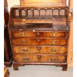 A mid 18th century walnut bureau, fitted four graduated drawers below, 36" wide