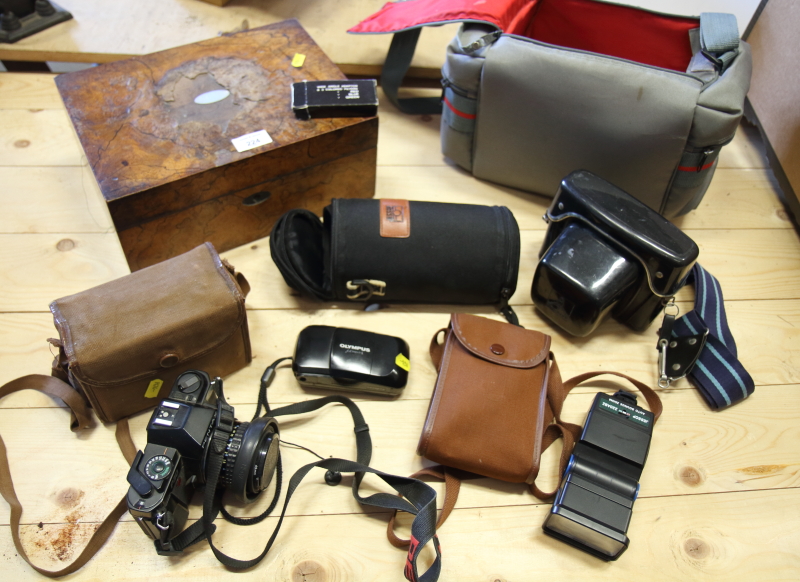 A collection of cameras, lenses, etc, in camera bag, and a Victorian walnut writing box