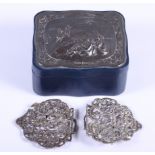 An Edwardian silver nurses buckle with pierced decoration and a blue leather jewellery box with