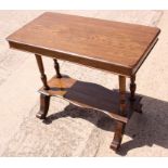 A rectangular oak two-tier centre table, on twin turned end supports, 34" x 18", and an early 20th