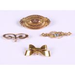 A 9ct gold bow brooch, another 9ct gold brooch, a Victorian yellow metal brooch and a gold bar