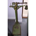 A set of green and gilt painted personal weighing scales