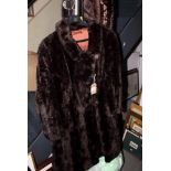 A moleskin fur coat with four feature buttons, back 43" long