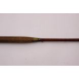 A vintage 9 foot cane fishing rod stamped "A&N CPL 105 Victoria Street Westminster"