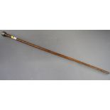 A swagger stick with silver pommel