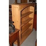 A pine open bookcase, fitted three adjustable shelves and reeded uprights, 48" wide