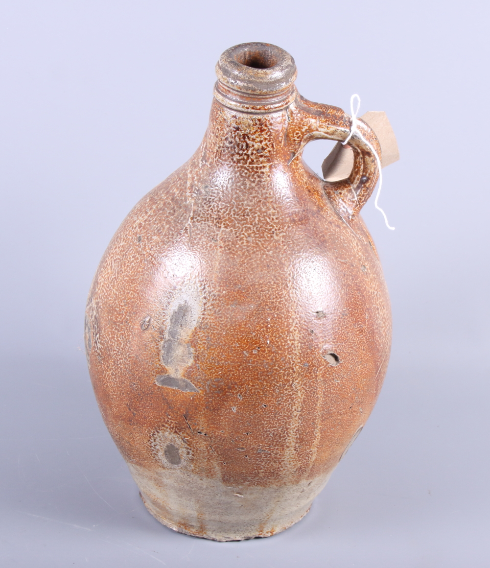 An 18th century stoneware flagon, 10 1/2" high, and a studio pottery shaped vase, 8 1/2" high